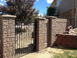 Pointed end picket metal gate installed by Waters & Son Construction