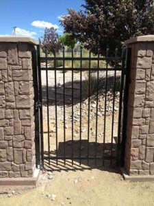 Welded fixed metal gate installed by Waters & Son Construction